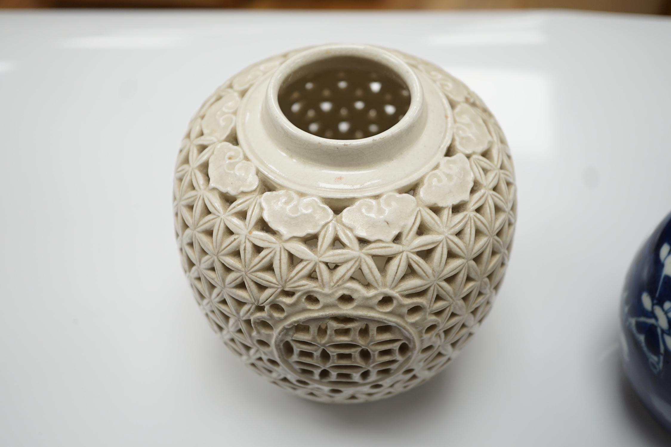 A 19th century Chinese blue and white jug, a similar jar and a pierced jar, tallest 15cm